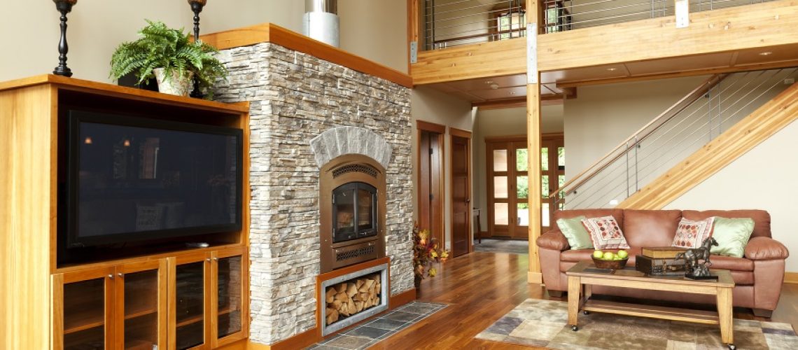 Custom home interior with solid walnut hardwood floor and a large fireplace.