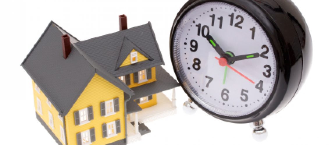 A bright yellow house with an alarm clock