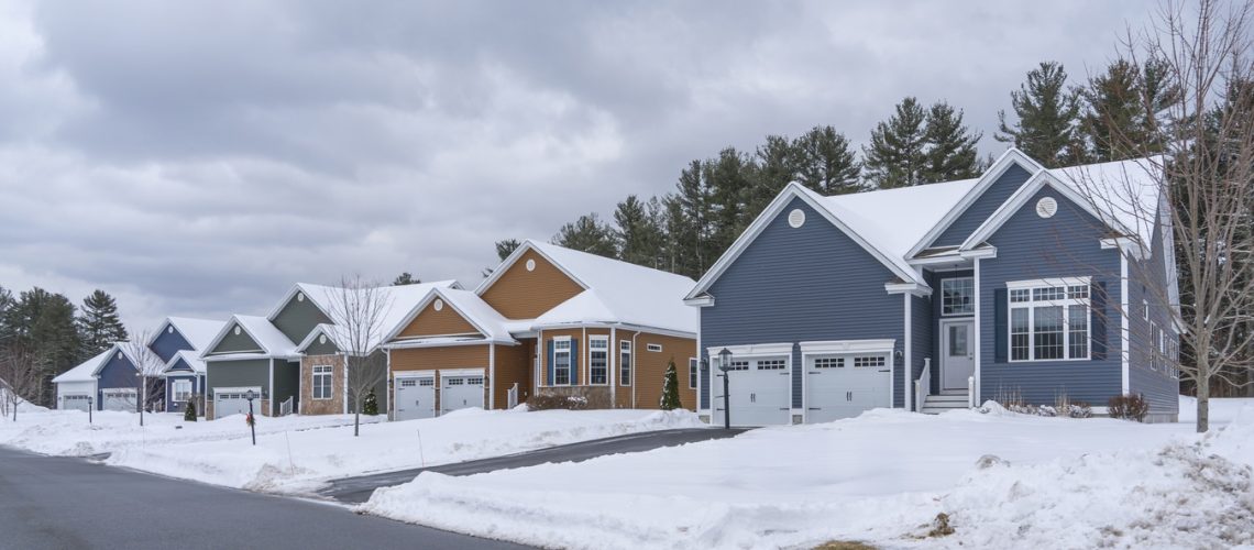 houses in residential community after snow in winter